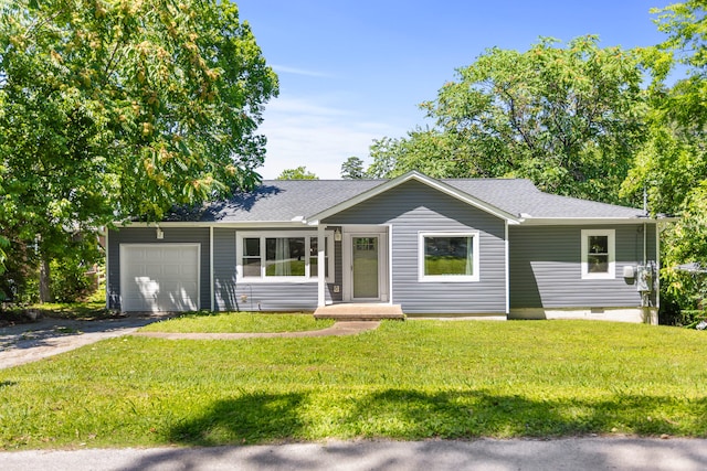 ranch-style home with a garage and a front yard