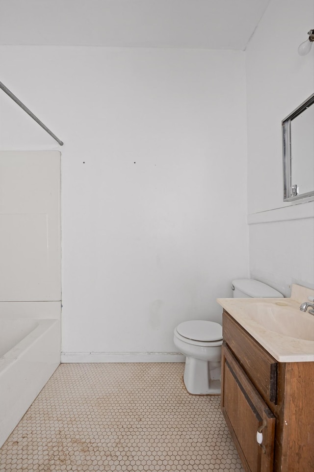 full bathroom featuring toilet, tile patterned floors, vanity, and shower / bathing tub combination