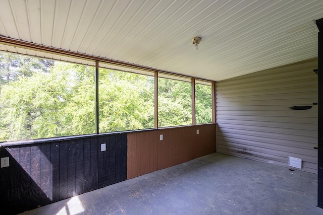 unfurnished sunroom with a wealth of natural light