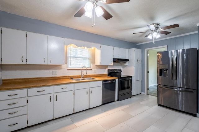 kitchen featuring a sink, ceiling fan, backsplash, under cabinet range hood, and appliances with stainless steel finishes