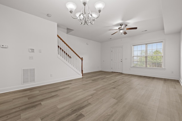7510 Noah Reid Rd, Chattanooga, TN 37416 - entrance foyer featuring stairway, ceiling fan, a chandelier, light wood-style flooring, and baseboards