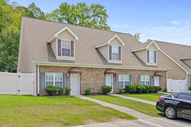 7510 Noah Reid Rd, Chattanooga, TN 37416 - view of front of house featuring a gate, brick siding, and roof with shingles