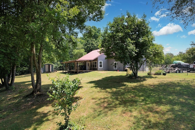 view of yard with a storage unit