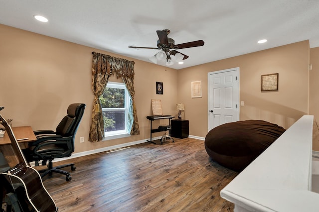 office featuring ceiling fan and dark hardwood / wood-style flooring