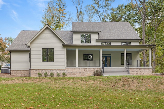 view of front facade featuring a porch and a front yard