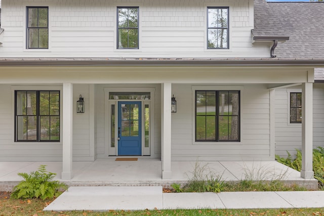 property entrance featuring covered porch