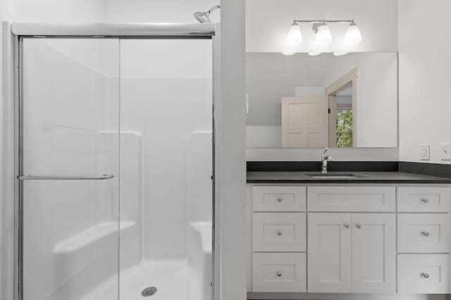 bathroom with vanity and an enclosed shower