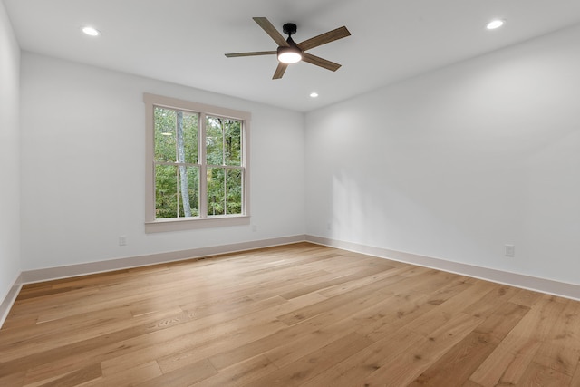 spare room with light hardwood / wood-style flooring and ceiling fan