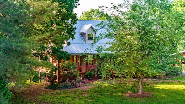 310 Moore Circle Rd, Charleston, TN 37310 - view of side of property with metal roof and a lawn