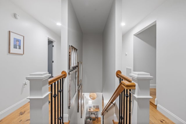 310 Moore Circle Rd, Charleston, TN 37310 - corridor featuring an upstairs landing, light wood-style flooring, baseboards, and recessed lighting