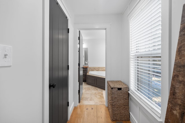 310 Moore Circle Rd, Charleston, TN 37310 - bathroom with a bath and wood finished floors