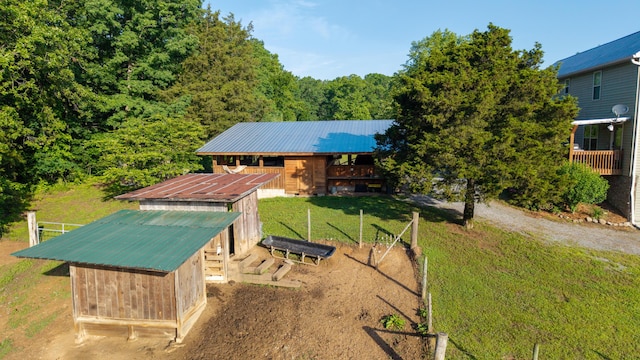 310 Moore Circle Rd, Charleston, TN 37310 - view of yard featuring an outbuilding, a view of trees, and an exterior structure