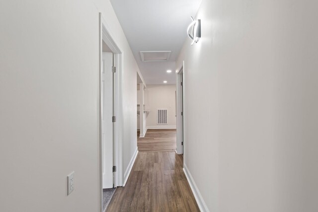 hallway featuring dark hardwood / wood-style flooring