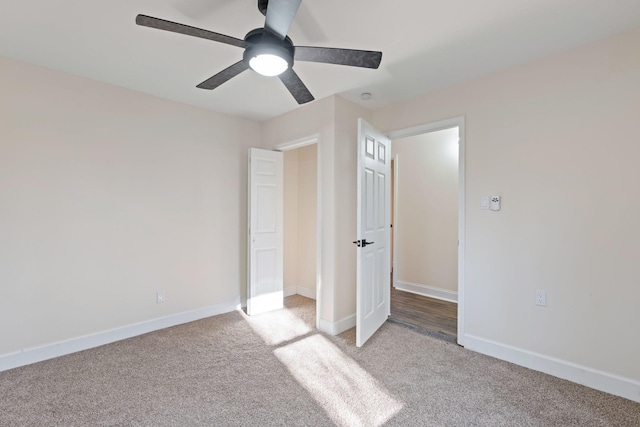 unfurnished bedroom featuring ceiling fan and light colored carpet