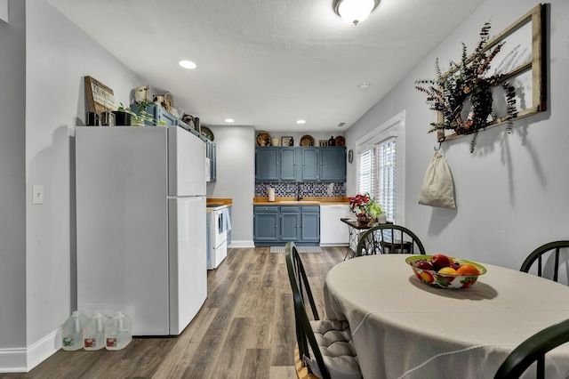 dining area with dark wood-type flooring