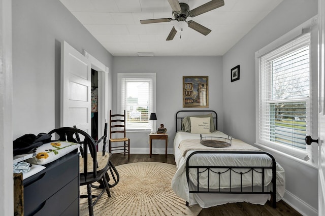 bedroom featuring dark hardwood / wood-style floors and ceiling fan