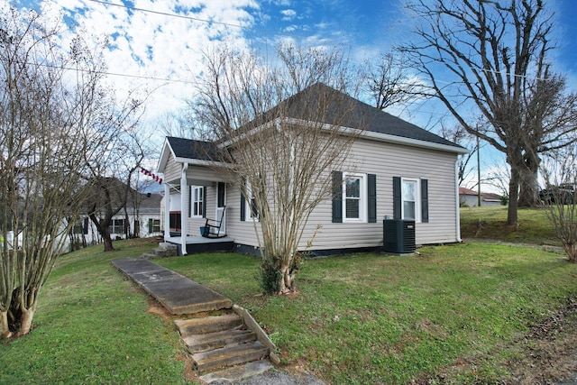 view of home's exterior with a yard and central AC unit