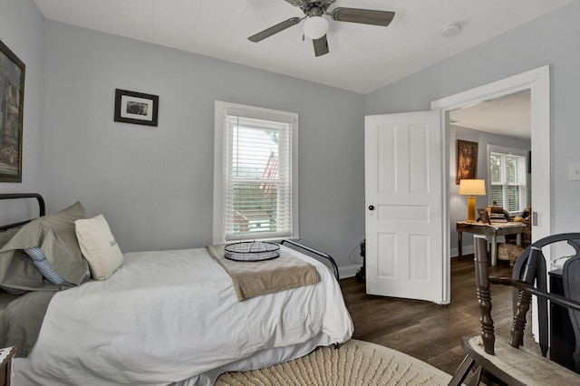 bedroom featuring ceiling fan and dark hardwood / wood-style flooring