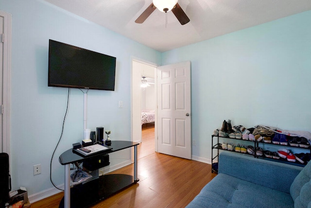 interior space with ceiling fan and hardwood / wood-style floors