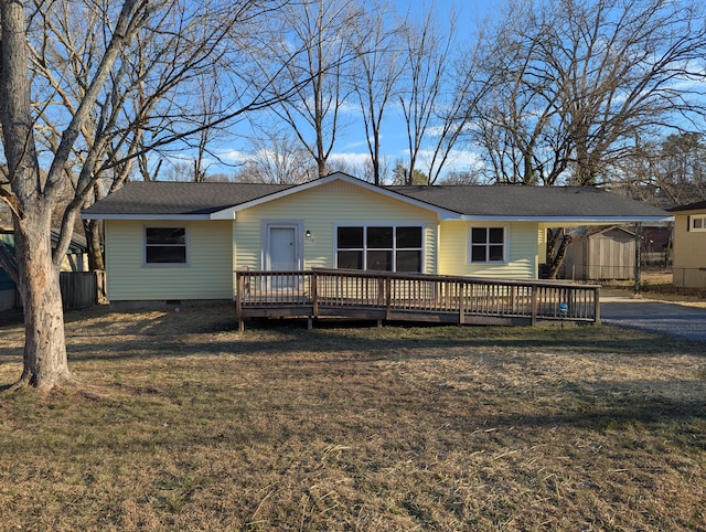 view of front of property featuring a deck and a front lawn