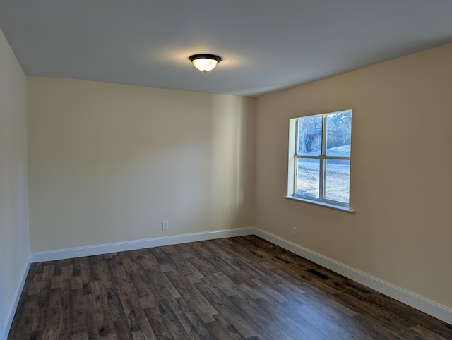 empty room with dark hardwood / wood-style floors