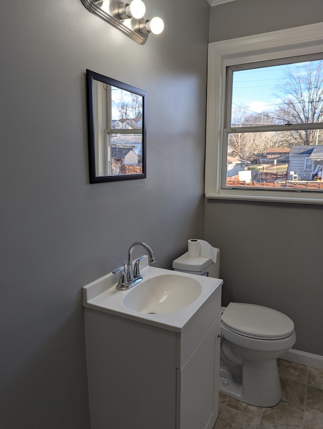 bathroom featuring vanity and toilet