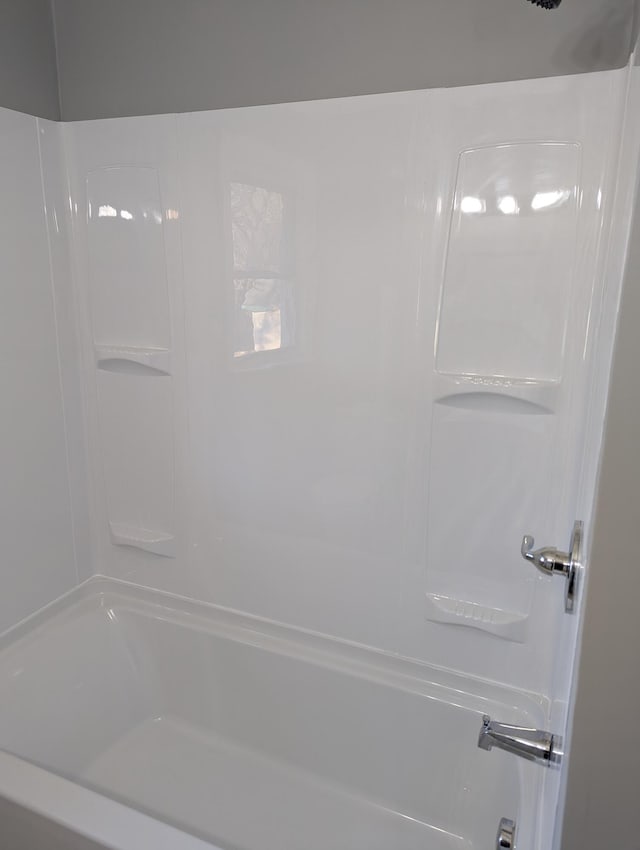 bathroom featuring washtub / shower combination