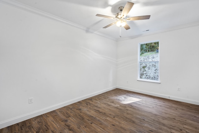 unfurnished room with ceiling fan, ornamental molding, and dark wood-type flooring