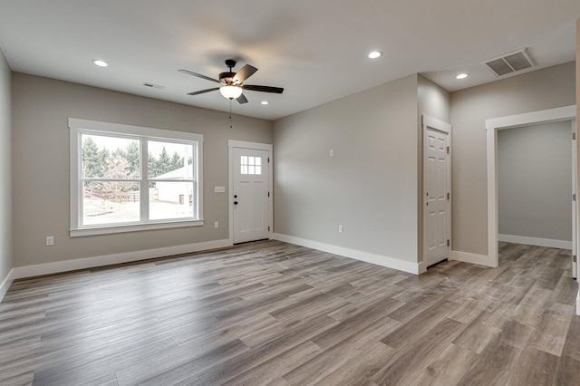 interior space with ceiling fan and light hardwood / wood-style floors