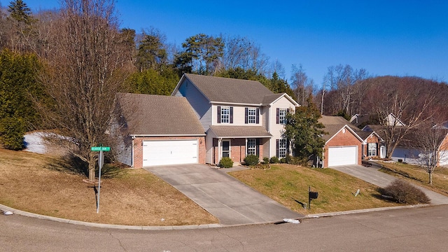 view of front of house featuring a front yard and a garage