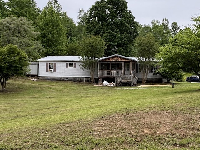 2025 County Road 750, Calhoun, TN 37309 - rear view of house with covered porch, a lawn, and crawl space