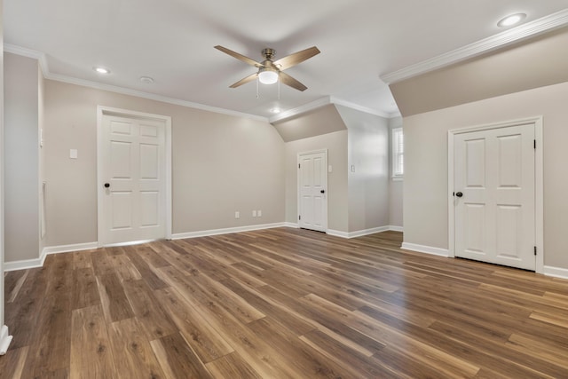 spare room with dark hardwood / wood-style flooring, crown molding, and ceiling fan