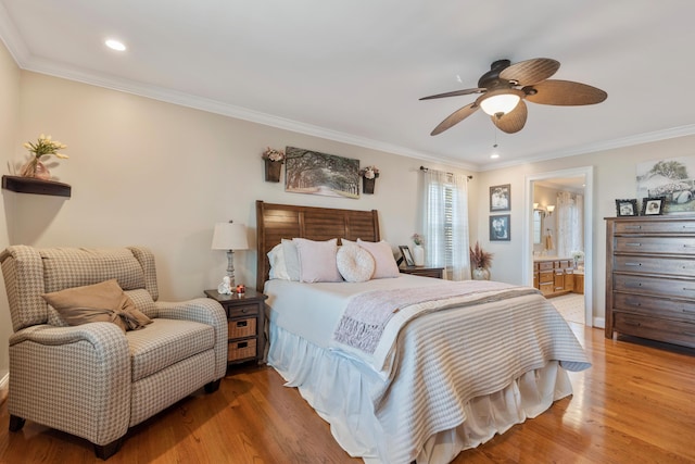 bedroom with ceiling fan, ornamental molding, ensuite bathroom, and light wood-type flooring