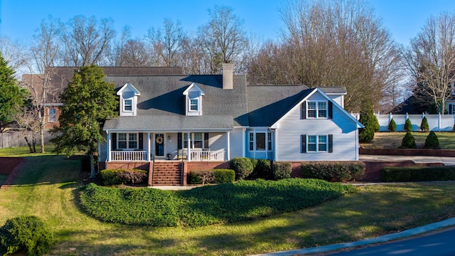 view of front of property with a porch and a front yard