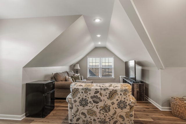 bedroom with dark hardwood / wood-style flooring and vaulted ceiling