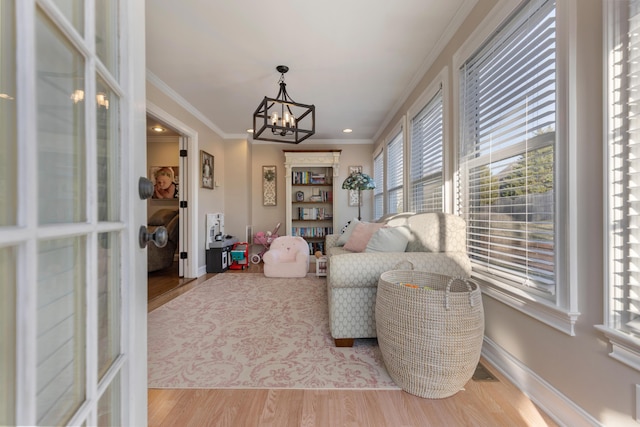 sunroom / solarium featuring a notable chandelier