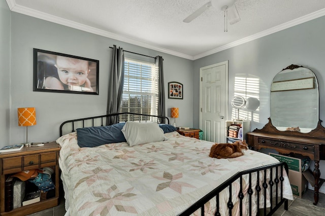 bedroom with a textured ceiling, a ceiling fan, and crown molding