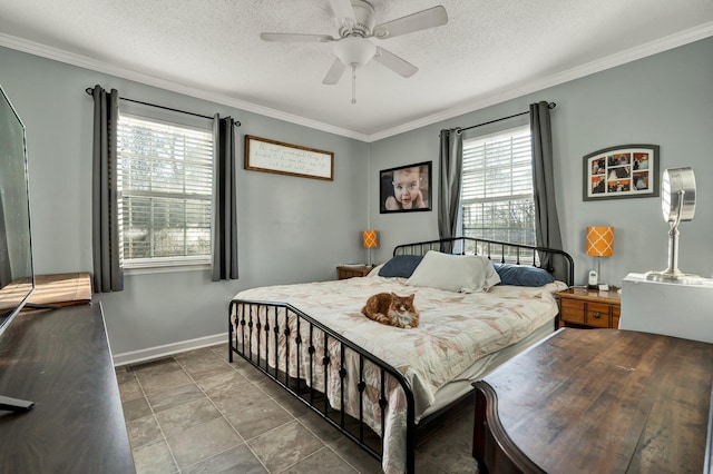 bedroom featuring a ceiling fan, crown molding, a textured ceiling, and baseboards