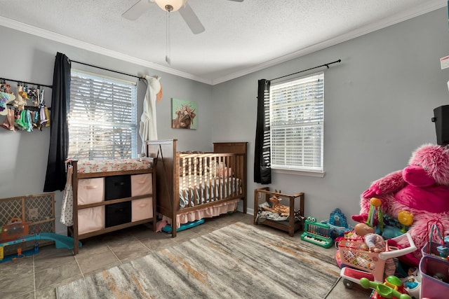 bedroom with ceiling fan, a textured ceiling, and crown molding