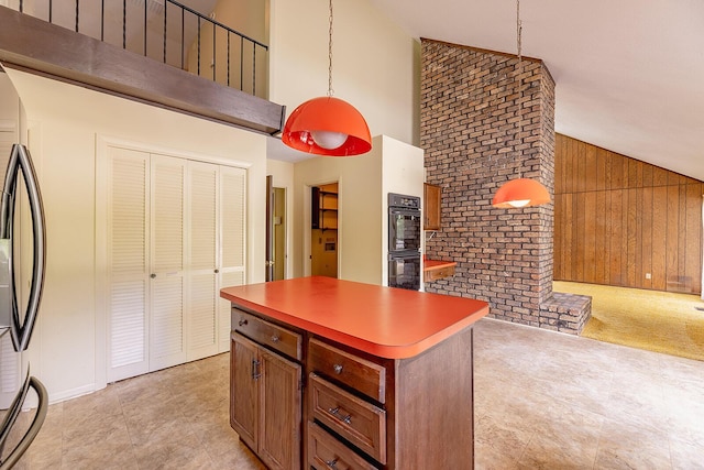 604 Augusta National Way, Knoxville, TN 37934 - kitchen featuring high vaulted ceiling, a center island, wood walls, fridge, and decorative light fixtures