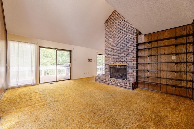 604 Augusta National Way, Knoxville, TN 37934 - unfurnished living room with carpet floors, high vaulted ceiling, a fireplace, and a textured ceiling