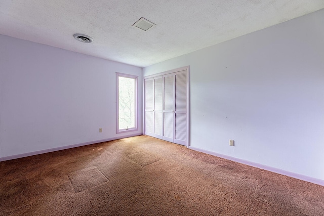 604 Augusta National Way, Knoxville, TN 37934 - unfurnished bedroom featuring light carpet, a closet, and a textured ceiling