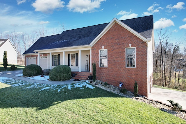 view of front of home with a garage and a front lawn