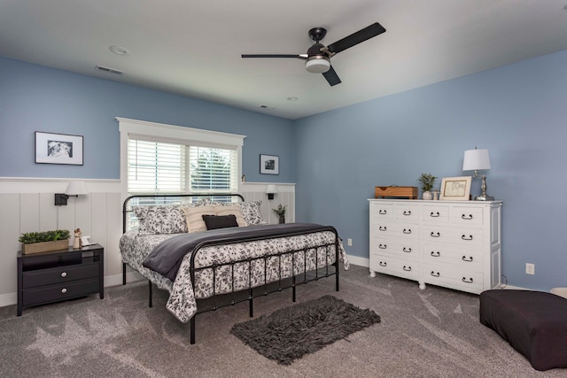 bedroom featuring dark colored carpet and ceiling fan