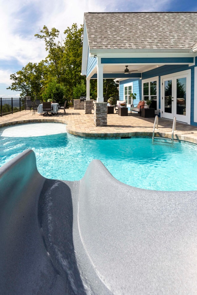 view of swimming pool with french doors, an outdoor living space, ceiling fan, and a patio area