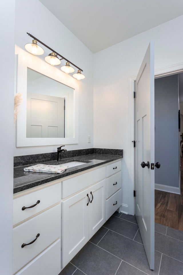 bathroom featuring tile patterned flooring and vanity