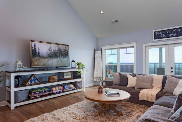 living room featuring french doors, high vaulted ceiling, and hardwood / wood-style flooring