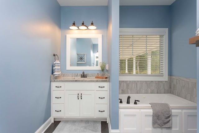 bathroom with vanity and a bathing tub