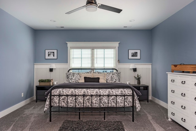 bedroom with dark colored carpet and ceiling fan