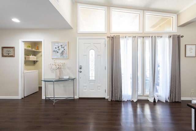 entryway with washer / clothes dryer and dark hardwood / wood-style flooring